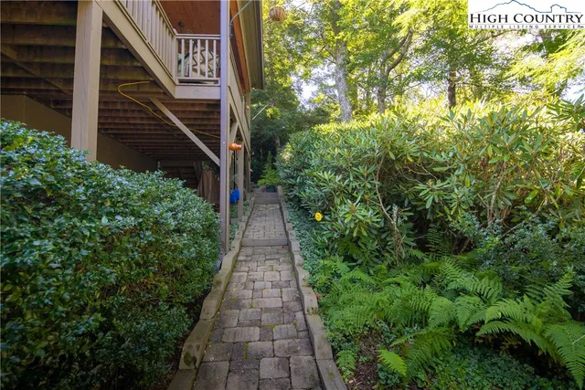 a view of a pathway with a house
