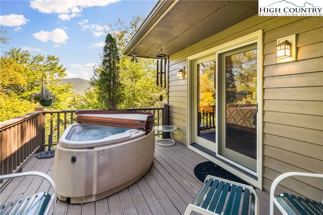 a view of balcony with furniture and wooden floor