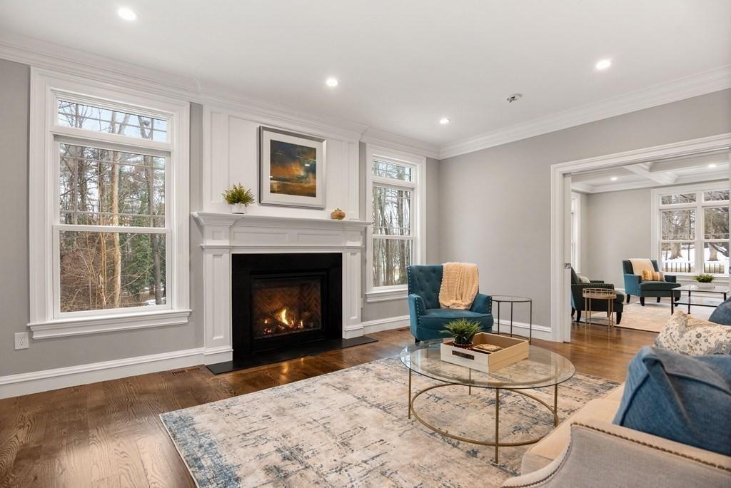 6 West Knoll Road Andover, MA 01810 - Photo 27 of 42 a living room with furniture and a fireplace