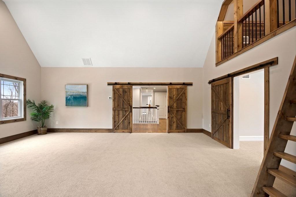 6 West Knoll Road Andover, MA 01810 - Photo 29 of 42 an empty room with windows