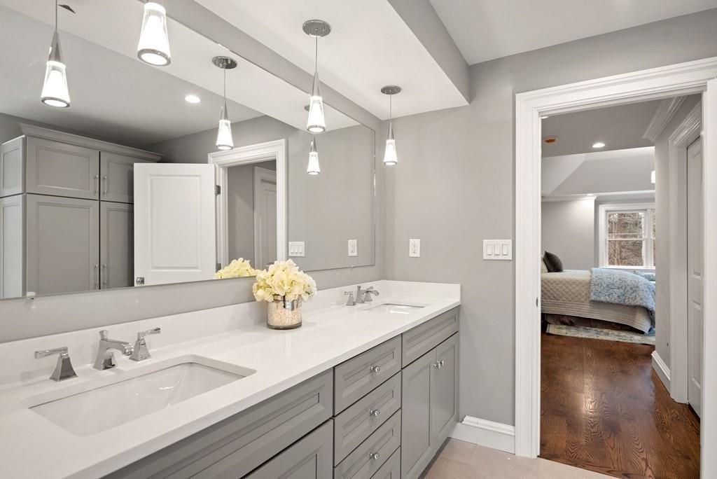 6 West Knoll Road Andover, MA 01810 - Photo 31 of 42 a en suite bathroom with double sink and a mirror