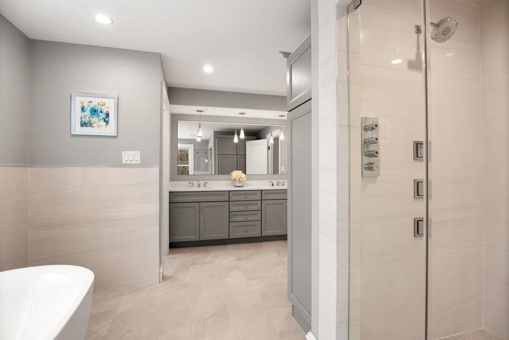 6 West Knoll Road Andover, MA 01810 - Photo 32 of 42 a bathroom with a granite countertop sink mirror and toilet