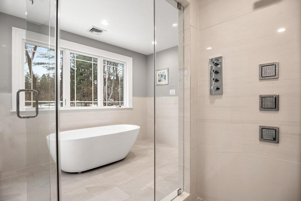 6 West Knoll Road Andover, MA 01810 - Photo 33 of 42 a bathroom with a bathtub and shower