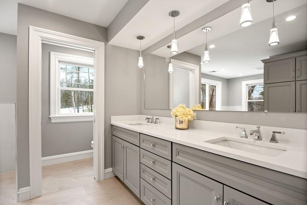 6 West Knoll Road Andover, MA 01810 - Photo 36 of 42 a bathroom with a granite countertop sink mirror and double