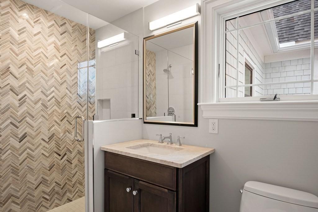 6 West Knoll Road Andover, MA 01810 - Photo 37 of 42 a bathroom with a sink and a mirror