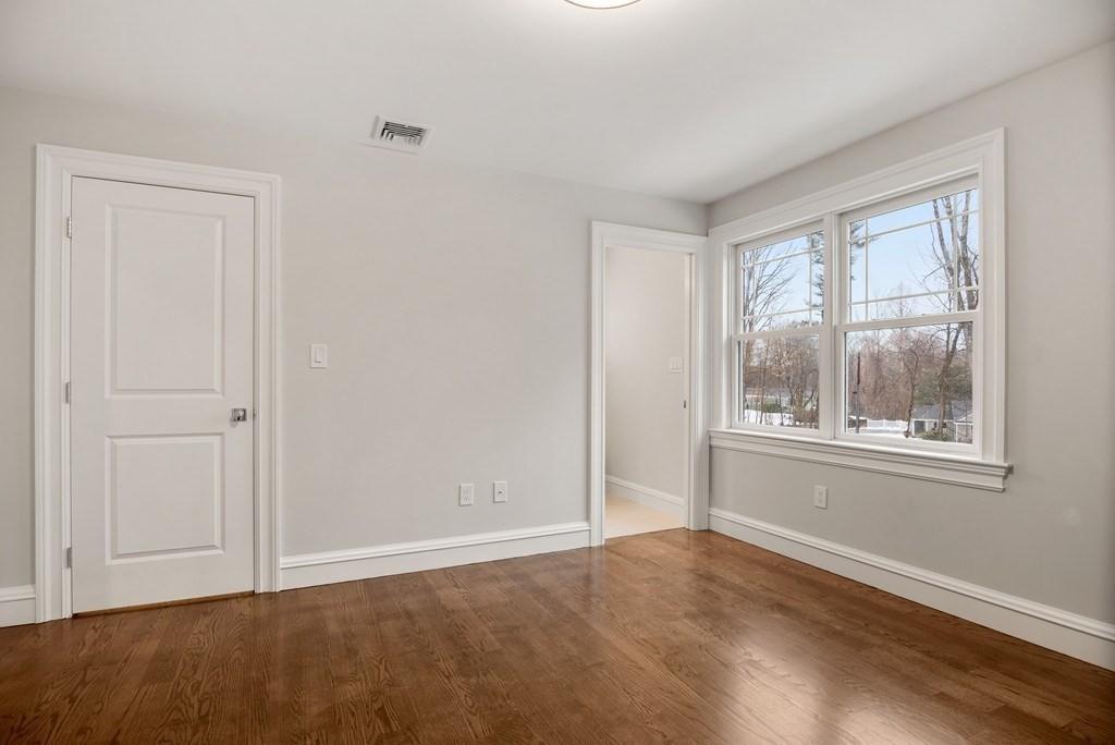 6 West Knoll Road Andover, MA 01810 - Photo 40 of 42 a view of an empty room with window and closet area