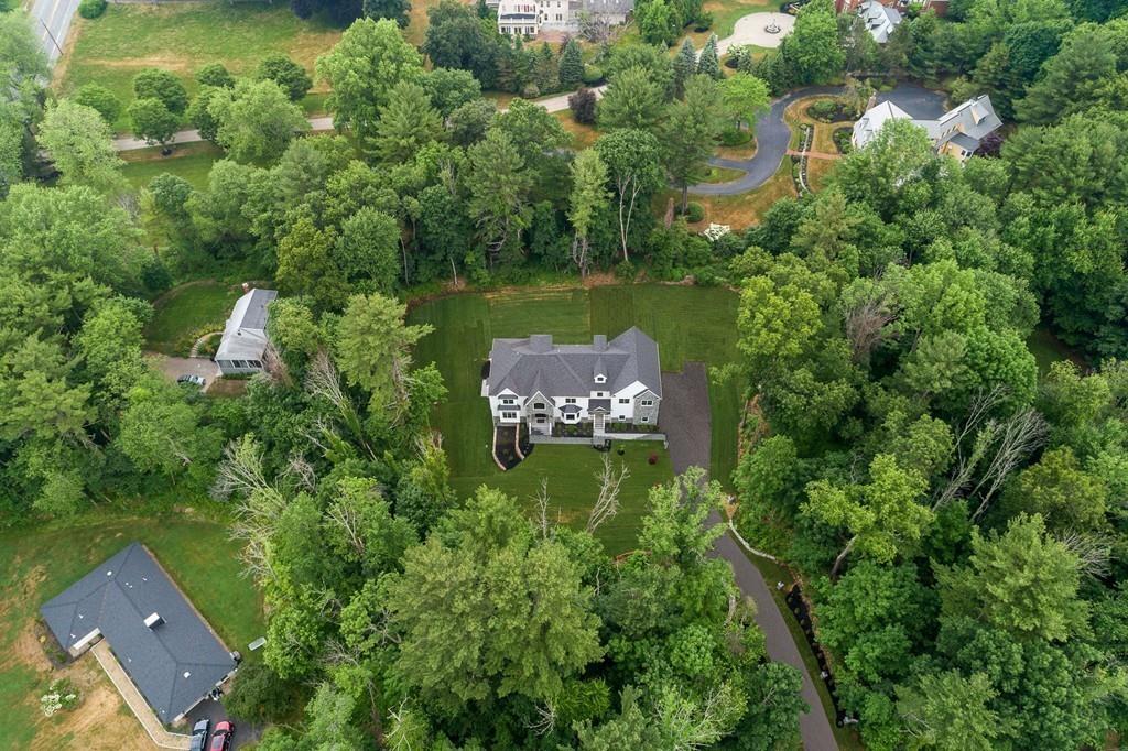 6 West Knoll Road Andover, MA 01810 - Photo 4 of 42 an aerial view of a house with a yard and lake view