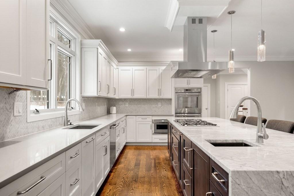 6 West Knoll Road Andover, MA 01810 - Photo 7 of 42 a kitchen with a stove sink and cabinets