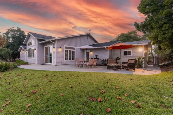 a view of a house with swimming pool and porch