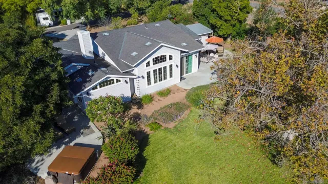 an aerial view of a house with a garden