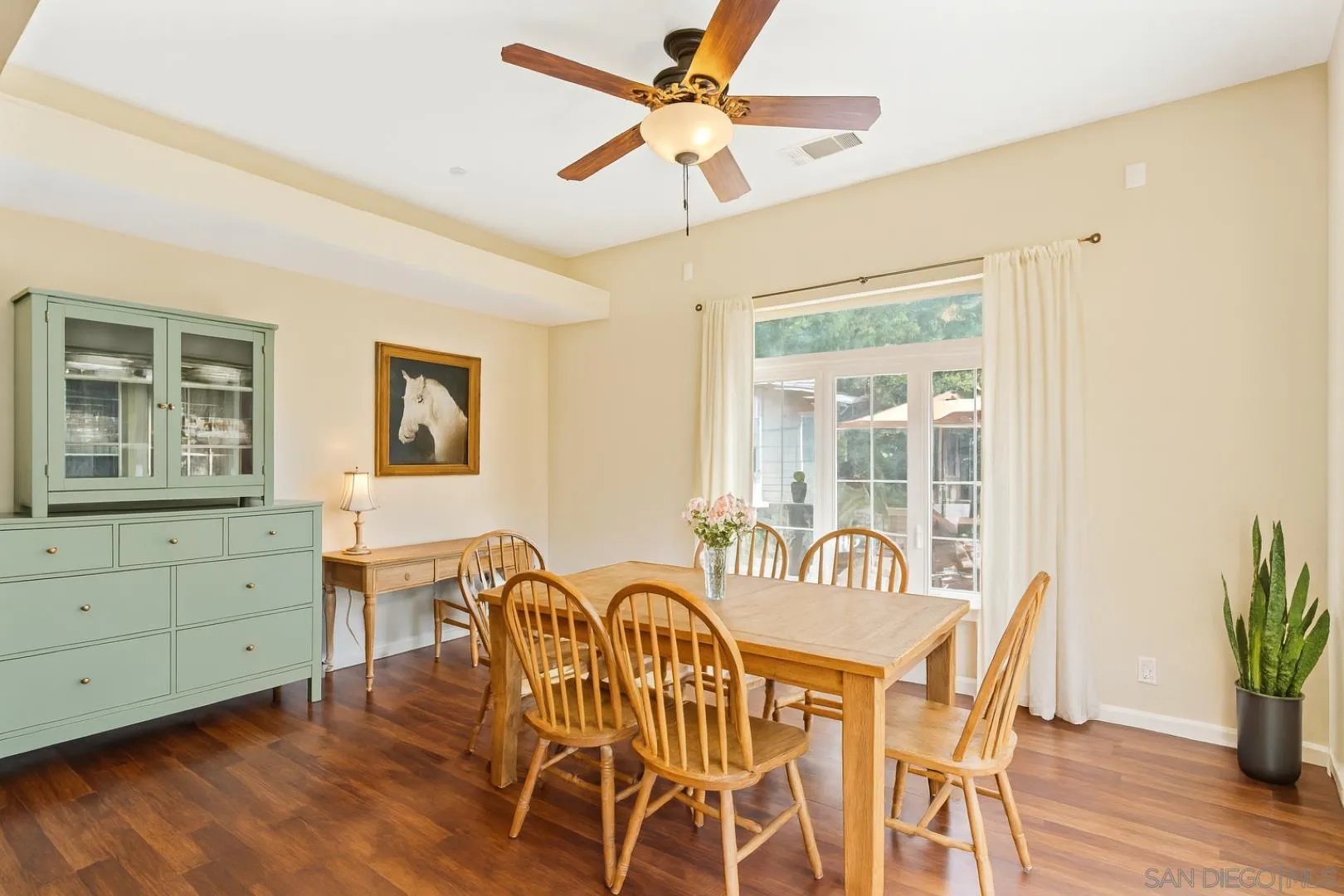3121 Alta Verde Drive Fallbrook, CA 92028 - Photo 10 of 31 a view of a dining room with furniture window and wooden floor