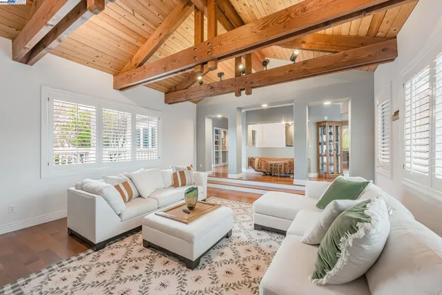 a kitchen with a table chairs stove and cabinets