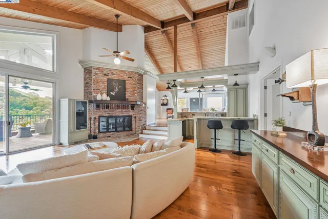 a view of a kitchen with a sink and wooden floor