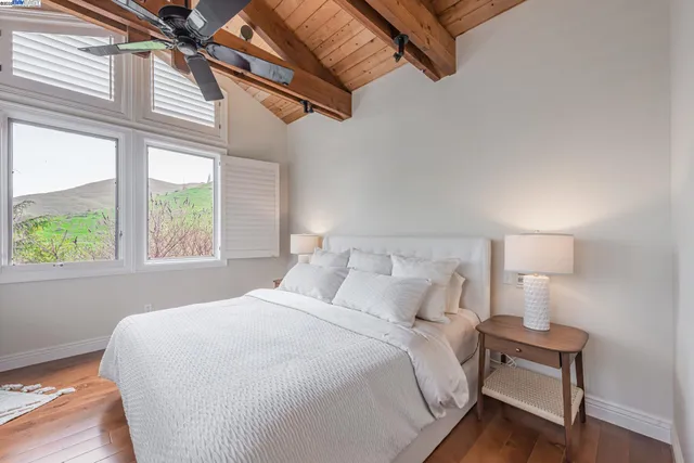 a spacious bathroom with a sink double vanity and a mirror