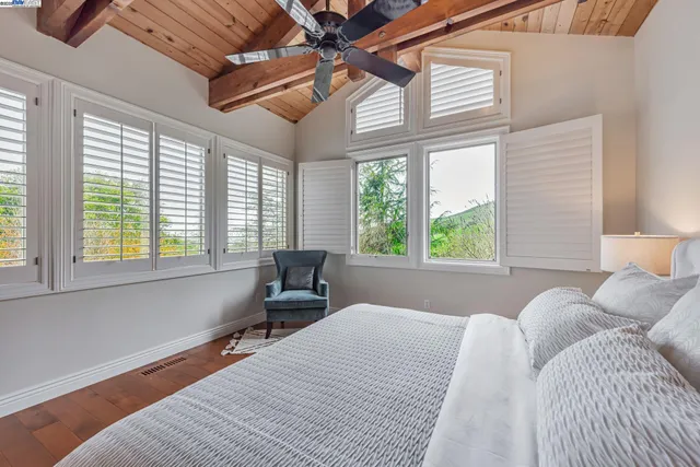 a spacious bathroom with a granite countertop sink and a large mirror