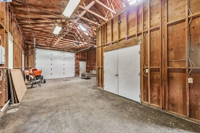 a view of a garden with a building in the background