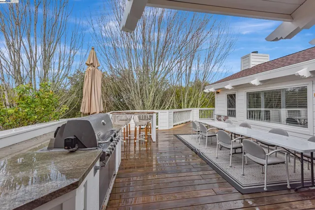 a view of a lush green hillside and a houses
