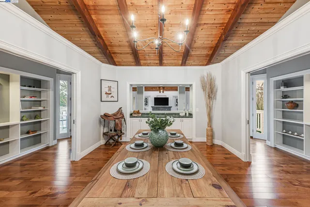 a living room with furniture ceiling fan and a rug