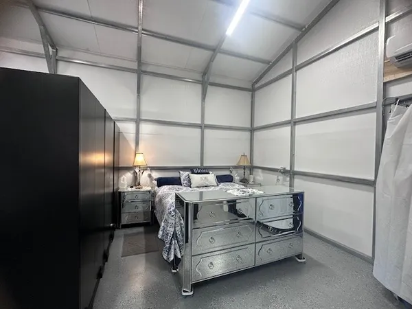 a bed room with furniture and a window