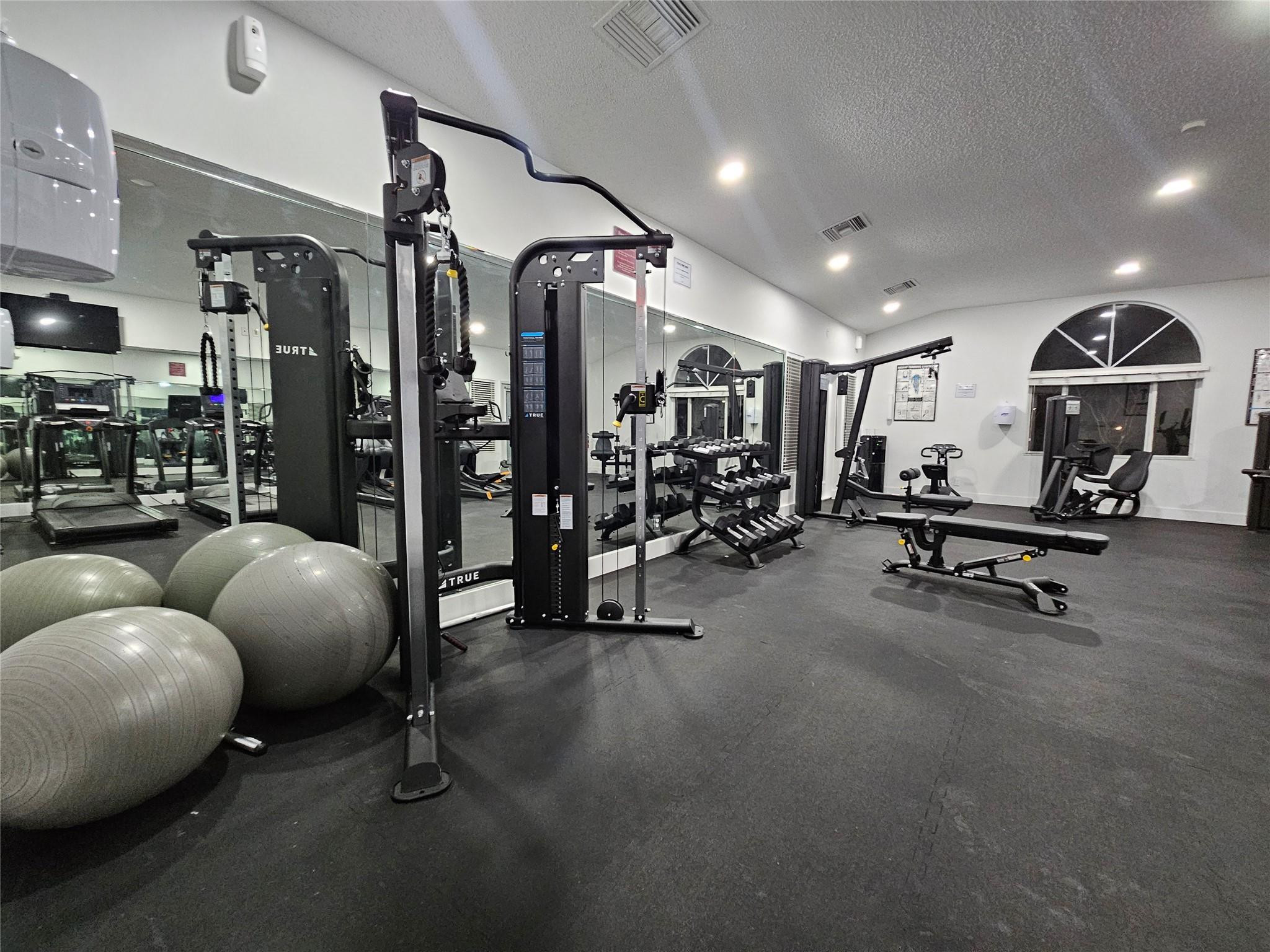 651 Lyons Road, Unit 10202 Coconut Creek, FL 33063 - Photo 18 of 28 a view of a room with gym equipment