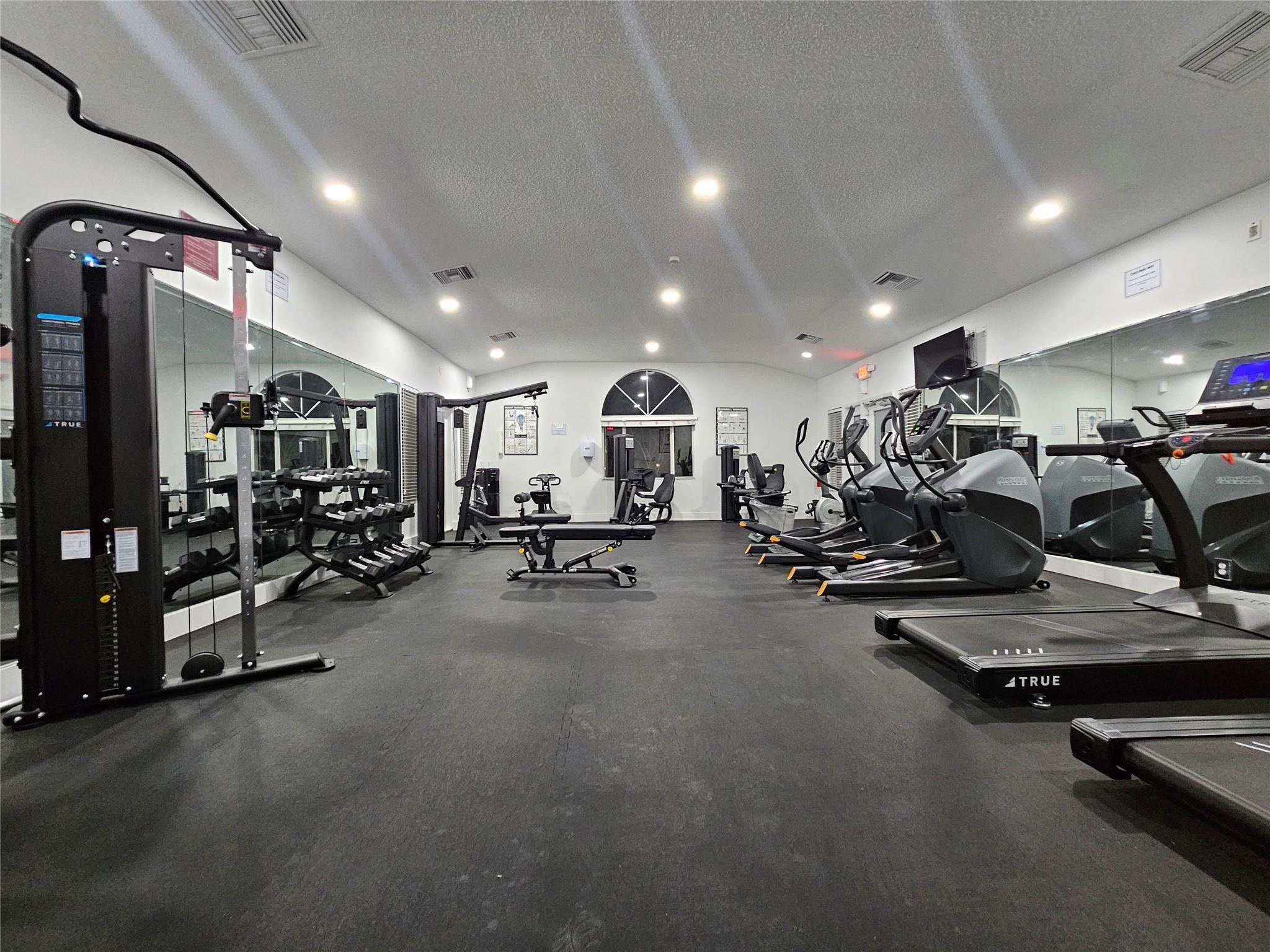 651 Lyons Road, Unit 10202 Coconut Creek, FL 33063 - Photo 20 of 28 a view of a room with gym equipment
