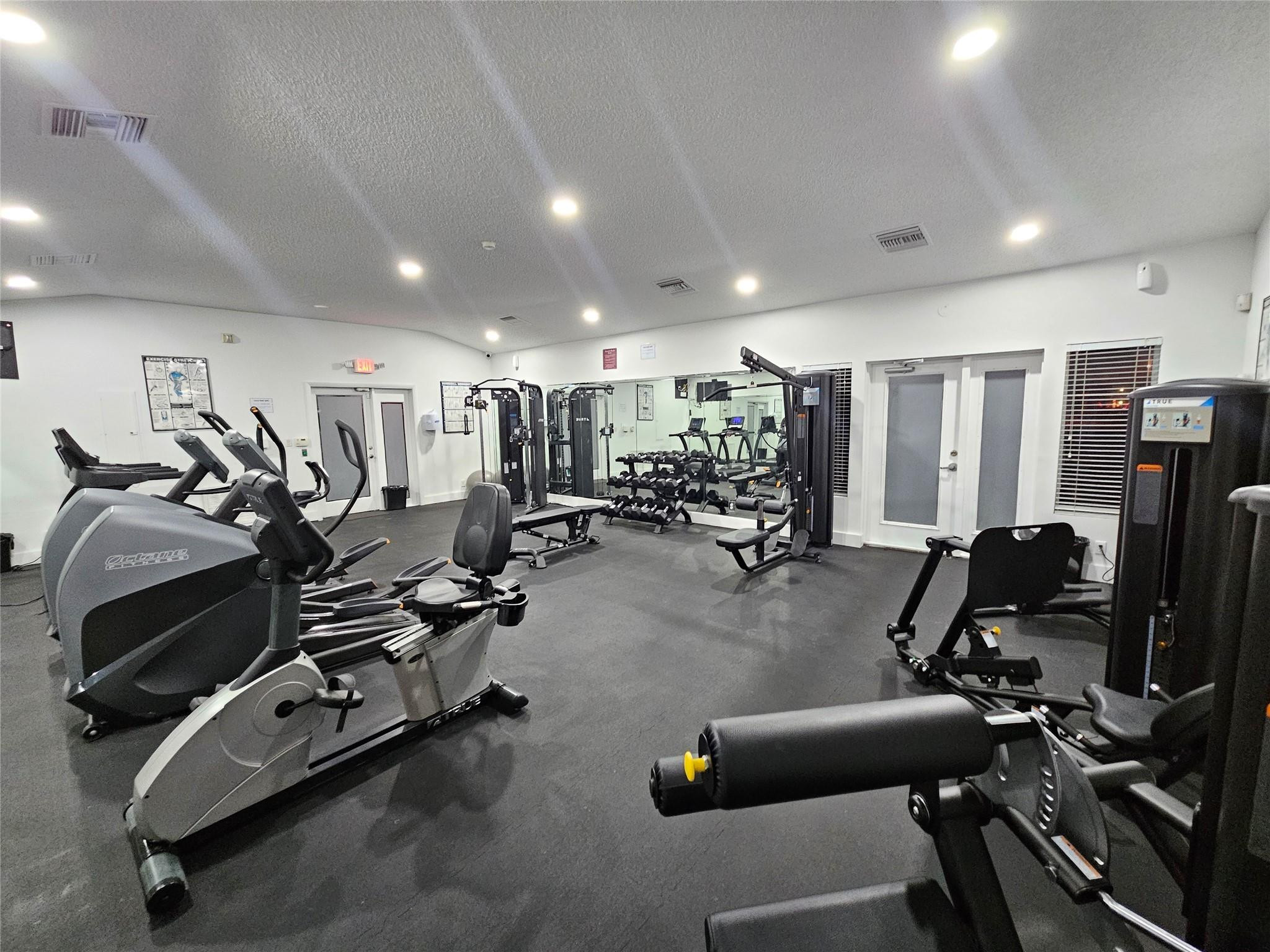 651 Lyons Road, Unit 10202 Coconut Creek, FL 33063 - Photo 21 of 28 a view of a room with gym equipment