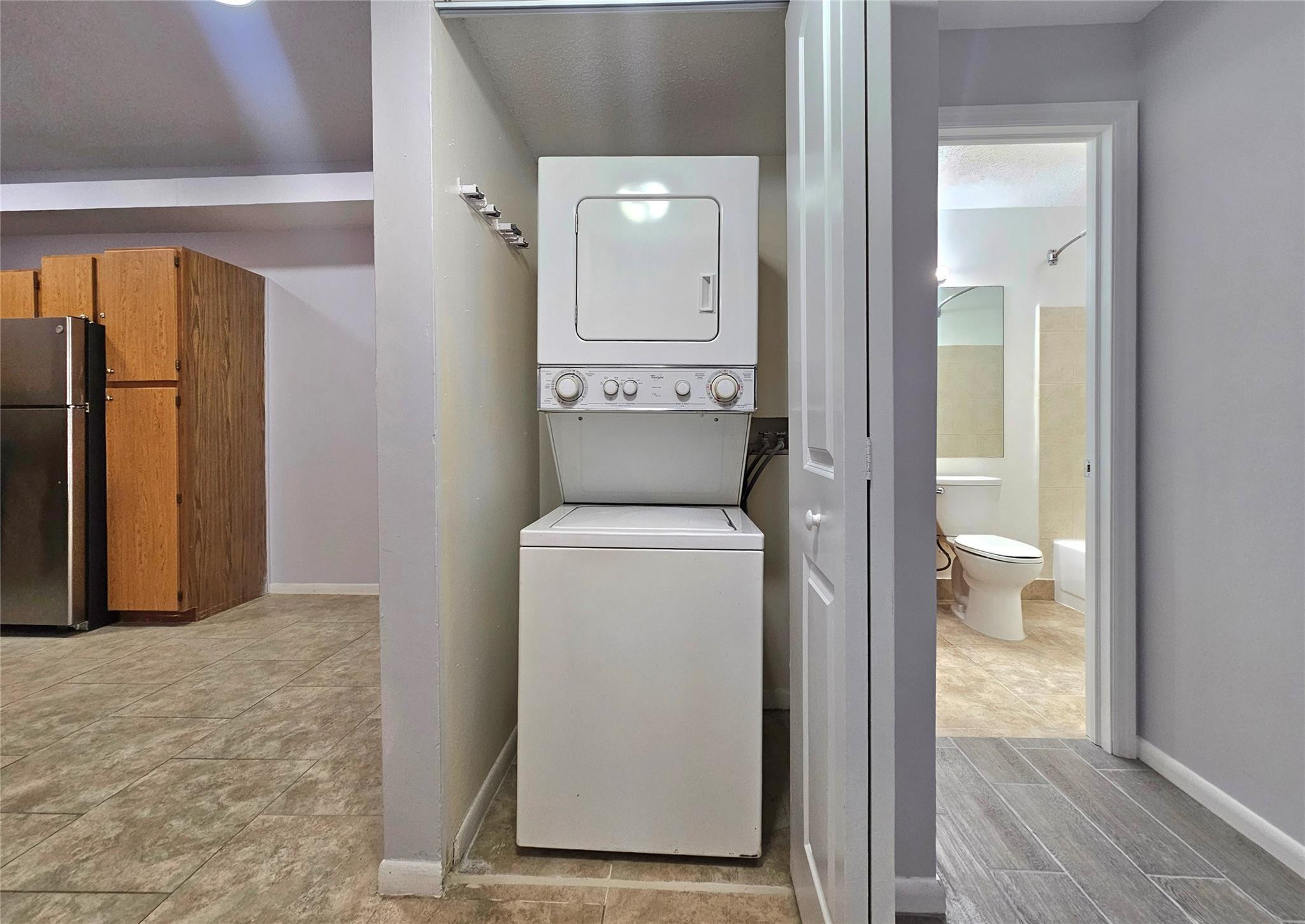 651 Lyons Road, Unit 10202 Coconut Creek, FL 33063 - Photo 6 of 28 a view of room with washer and dryer