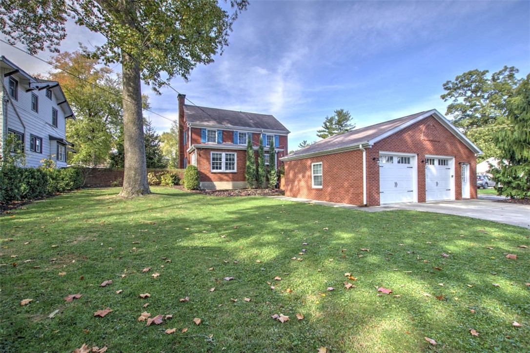 266 Cobb Avenue Decatur, IL 62522 - Photo 8 of 35 a view of a yard in front of a brick house with large windows