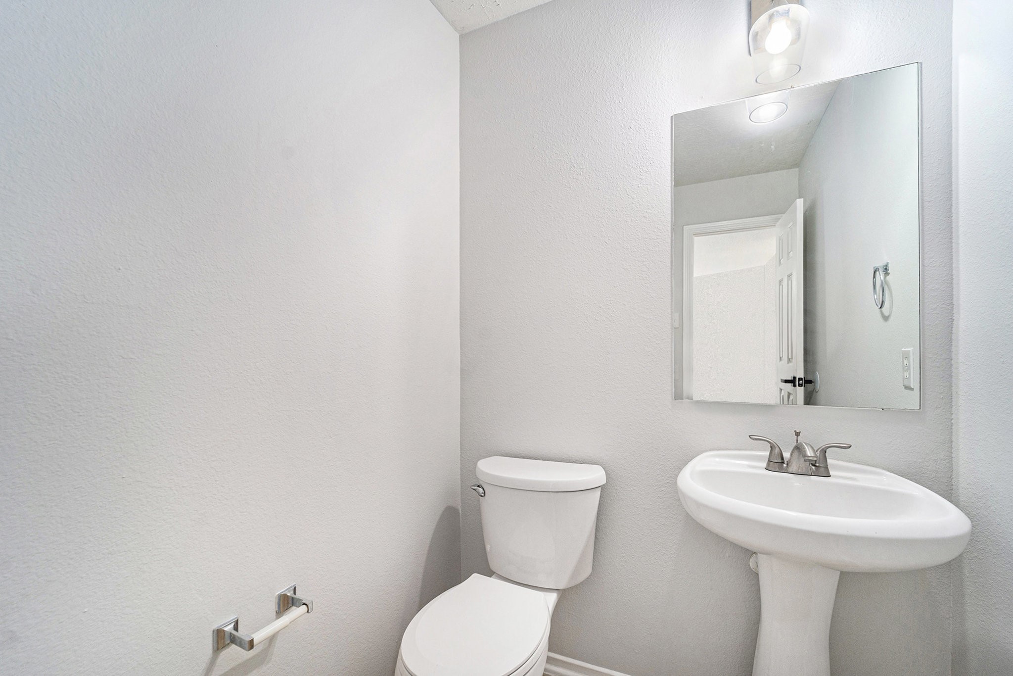 18131 Stone Trail Manor Drive Humble, TX 77346 - Photo 15 of 31 a bathroom with a toilet sink and mirror