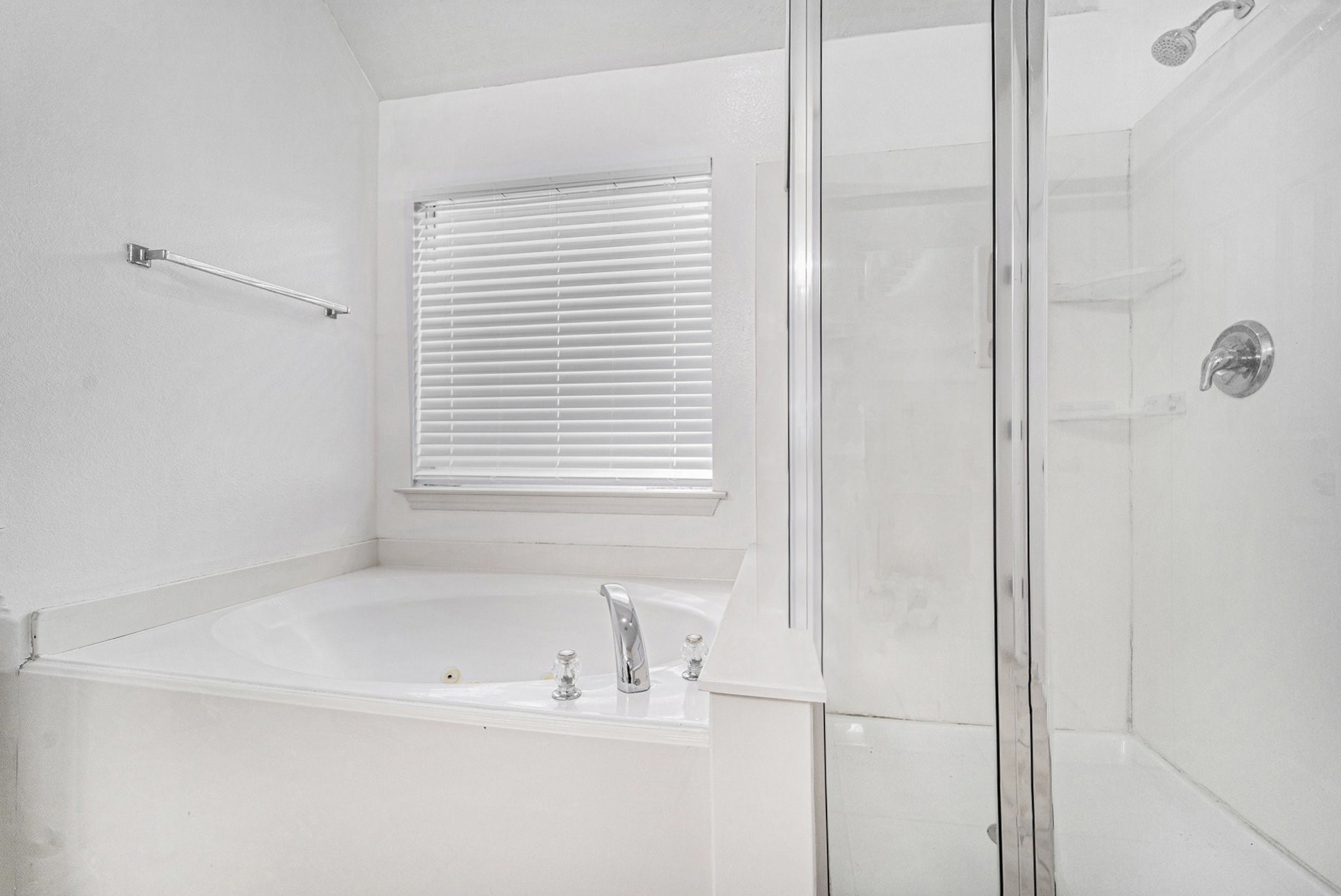 18131 Stone Trail Manor Drive Humble, TX 77346 - Photo 19 of 31 a white bath tub sitting next to a window