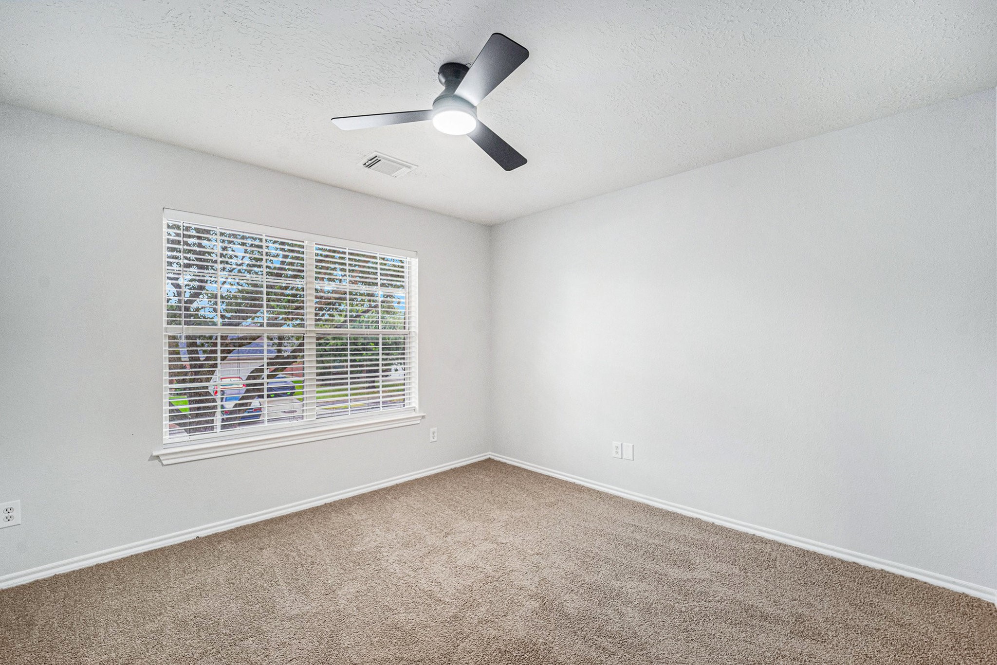18131 Stone Trail Manor Drive Humble, TX 77346 - Photo 22 of 31 an empty room with a window