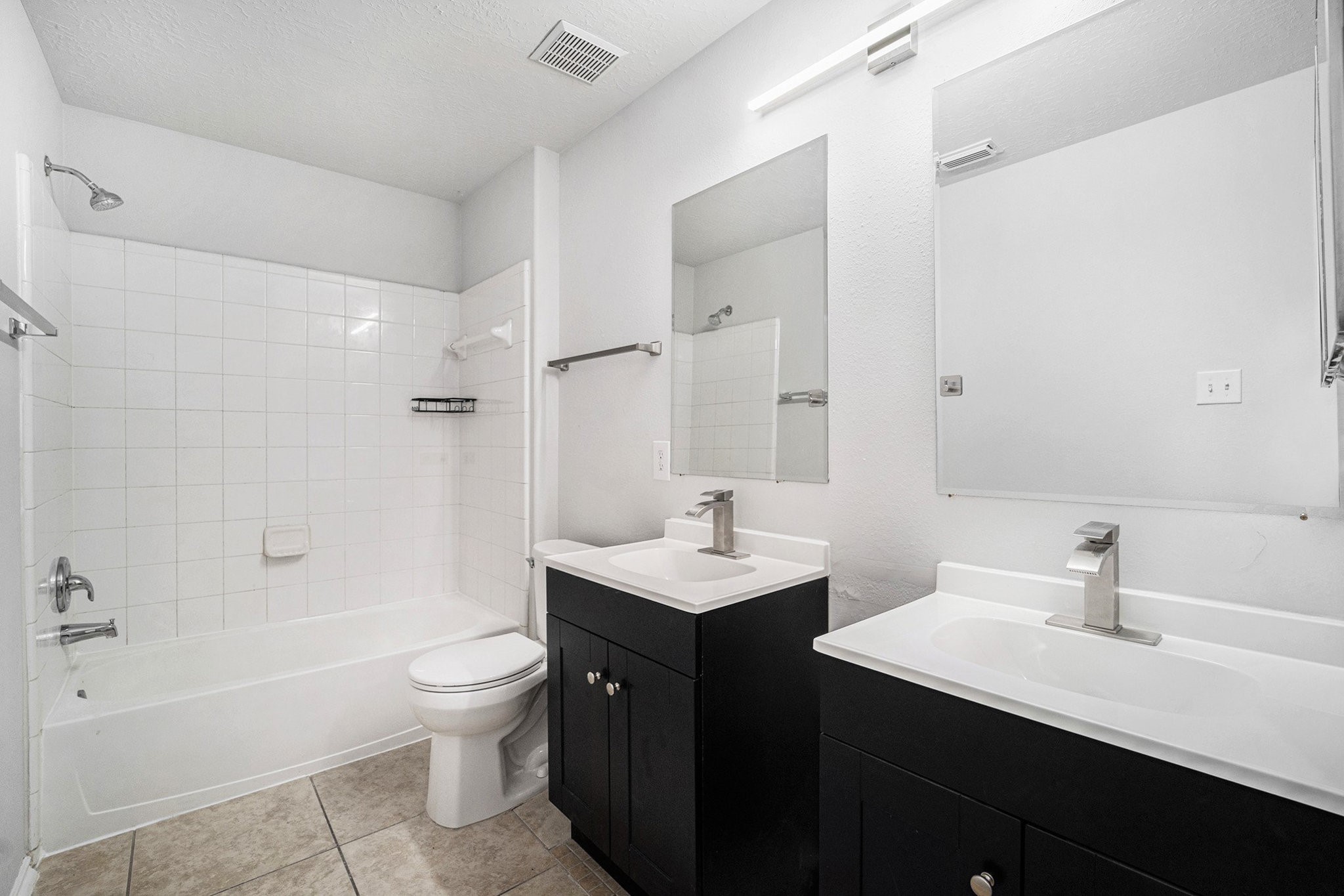 18131 Stone Trail Manor Drive Humble, TX 77346 - Photo 24 of 31 a bathroom with a sink a toilet and shower