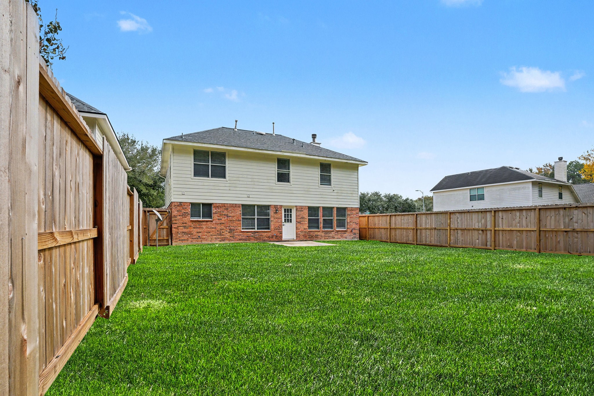 18131 Stone Trail Manor Drive Humble, TX 77346 - Photo 28 of 31 a view of a house with backyard and porch