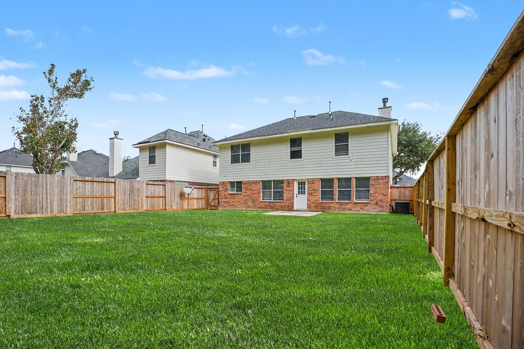 18131 Stone Trail Manor Drive Humble, TX 77346 - Photo 29 of 31 a view of a house with backyard and garden