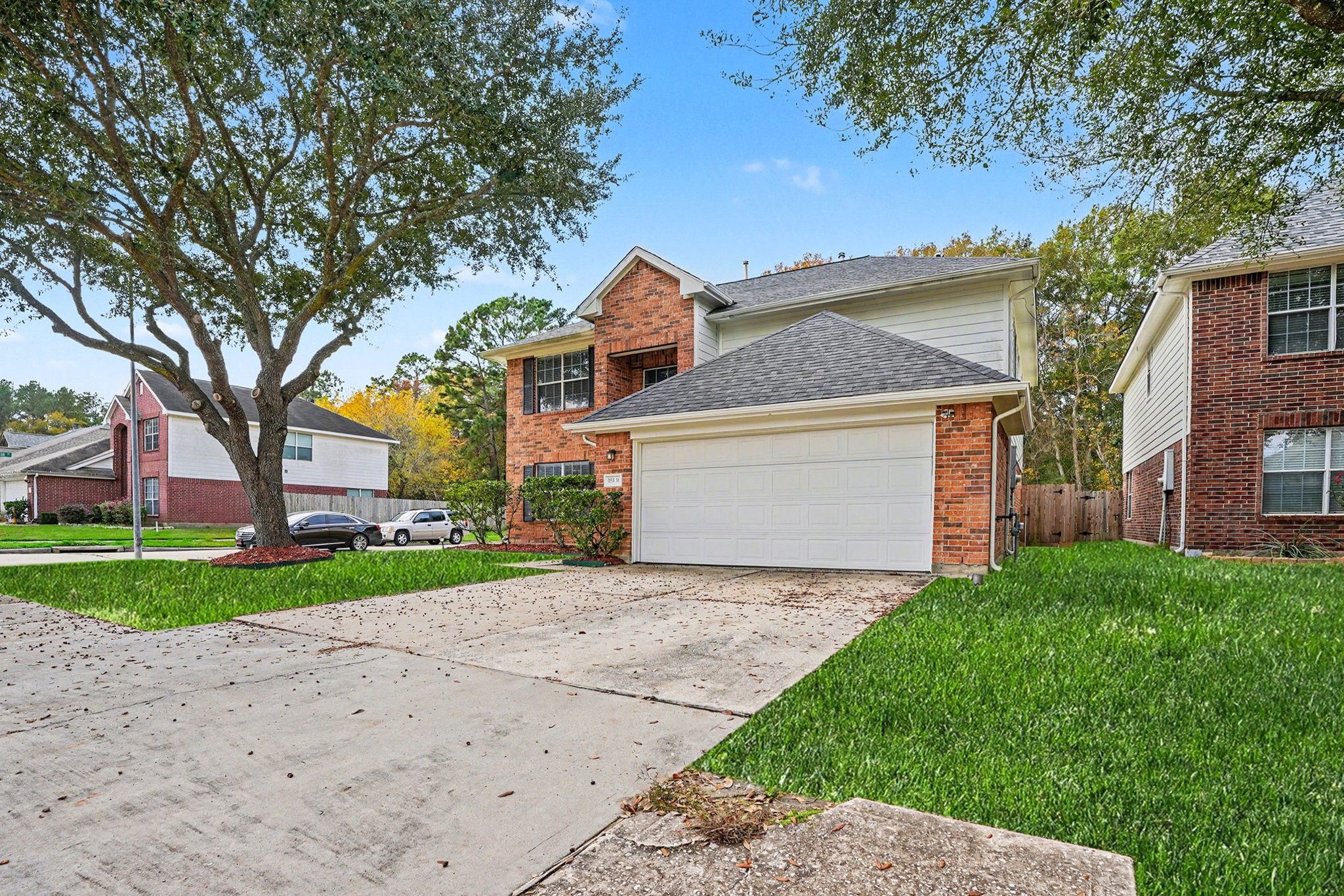 18131 Stone Trail Manor Drive Humble, TX 77346 - Photo 4 of 31 a front view of a house with a yard and garage