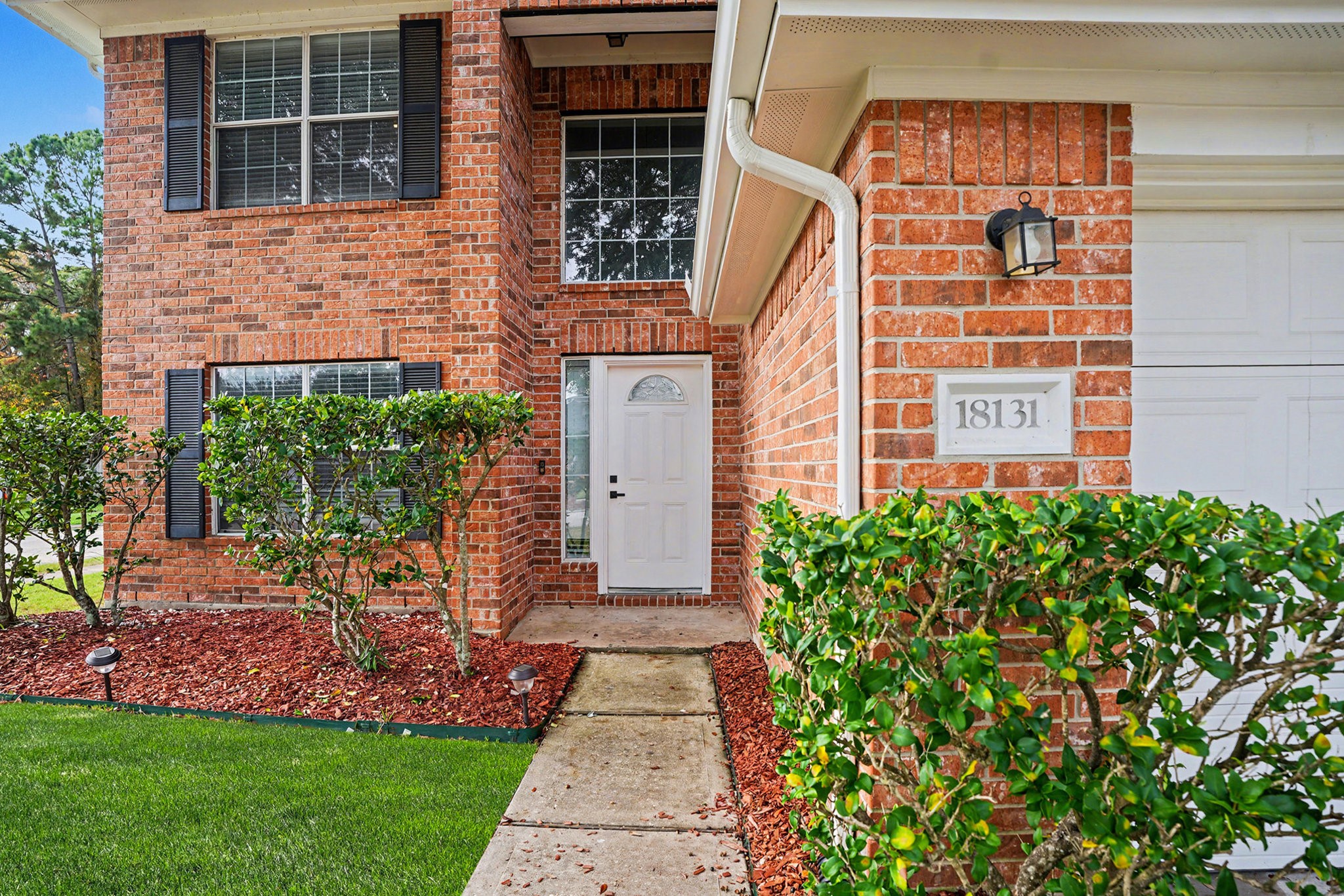 18131 Stone Trail Manor Drive Humble, TX 77346 - Photo 5 of 31 a front view of a house with garden