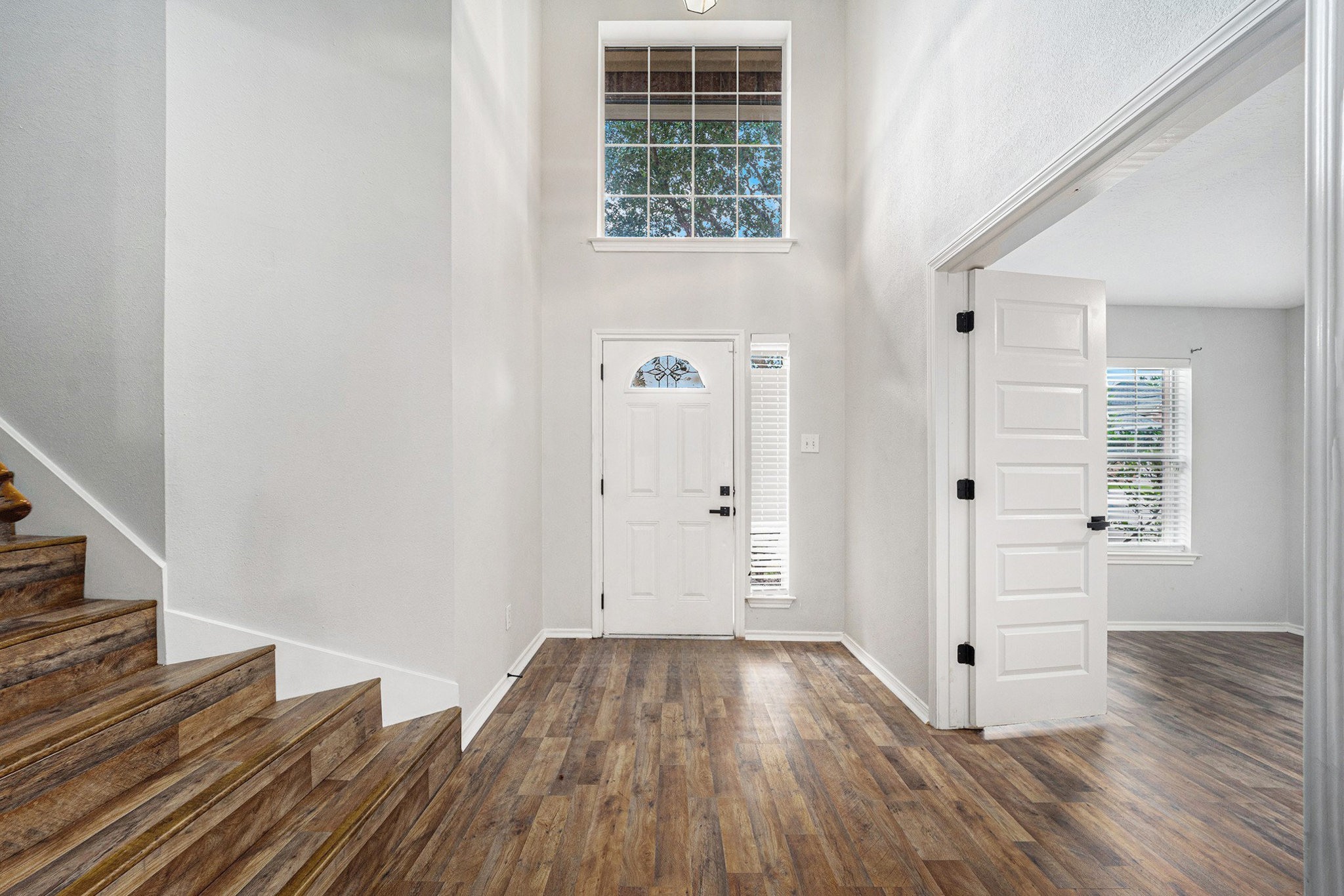 18131 Stone Trail Manor Drive Humble, TX 77346 - Photo 6 of 31 wooden floor in an empty room with a window