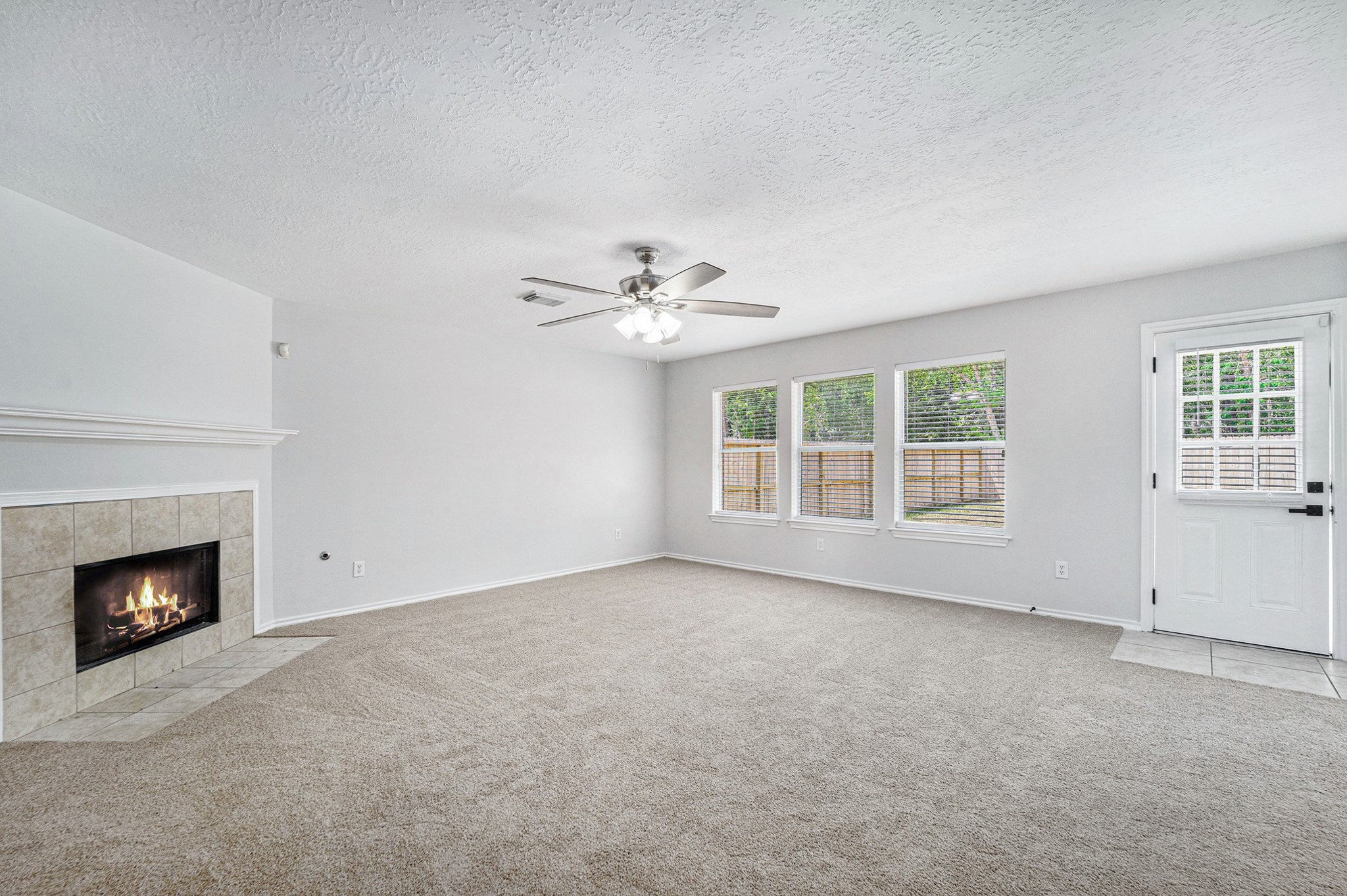 18131 Stone Trail Manor Drive Humble, TX 77346 - Photo 10 of 31 a view of an empty room with a fireplace