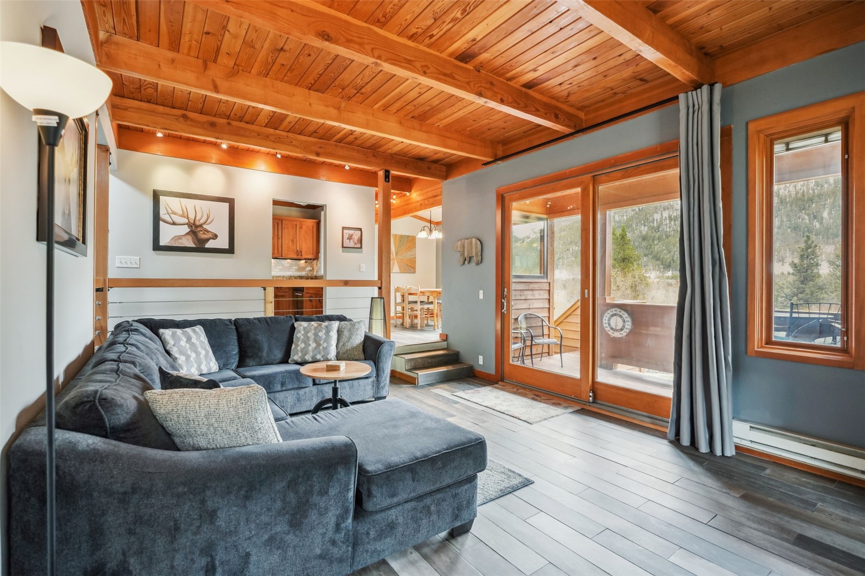 530 Tennis Club Road, Unit 1328 Keystone, CO 80435 - Photo 1 of 43 Living room with beamed ceilings, mountain views, rail lighting, and updated floors