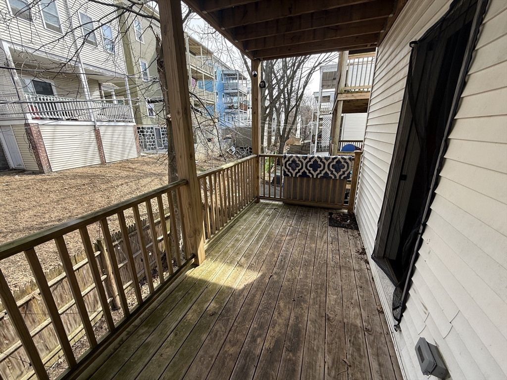 101 Draper Street, Unit 2 Boston, MA 02122 - Photo 16 of 19 a view of balcony with wooden floor