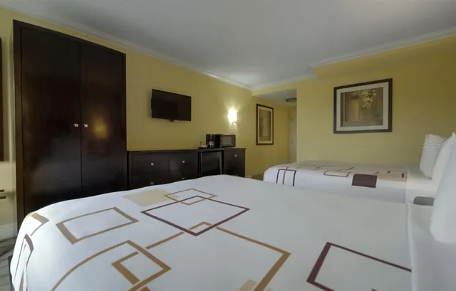 a kitchen with a table and chairs