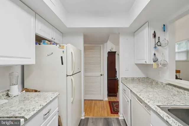 a kitchen with a sink and a stove top oven