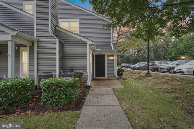 a view of a car parked in front of a house