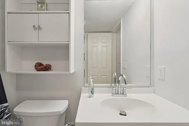 a large bed sitting in a bedroom next to a window