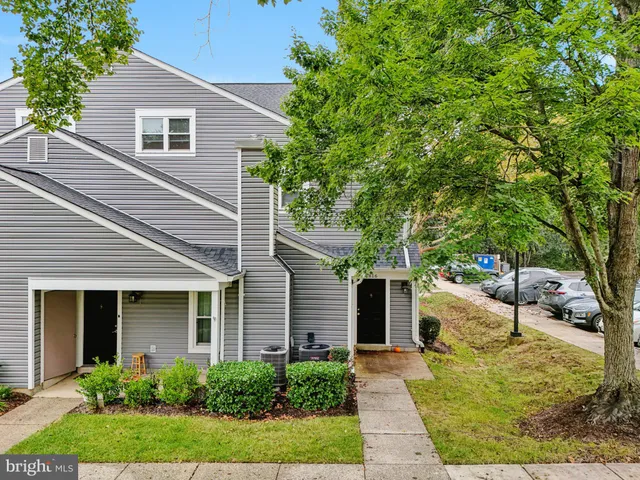 a view of a parked cars in front of a house