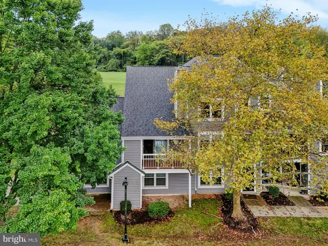 an aerial view of a house with outdoor space swimming pool patio and mountain view