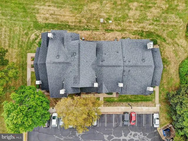 an aerial view of a house with a garden