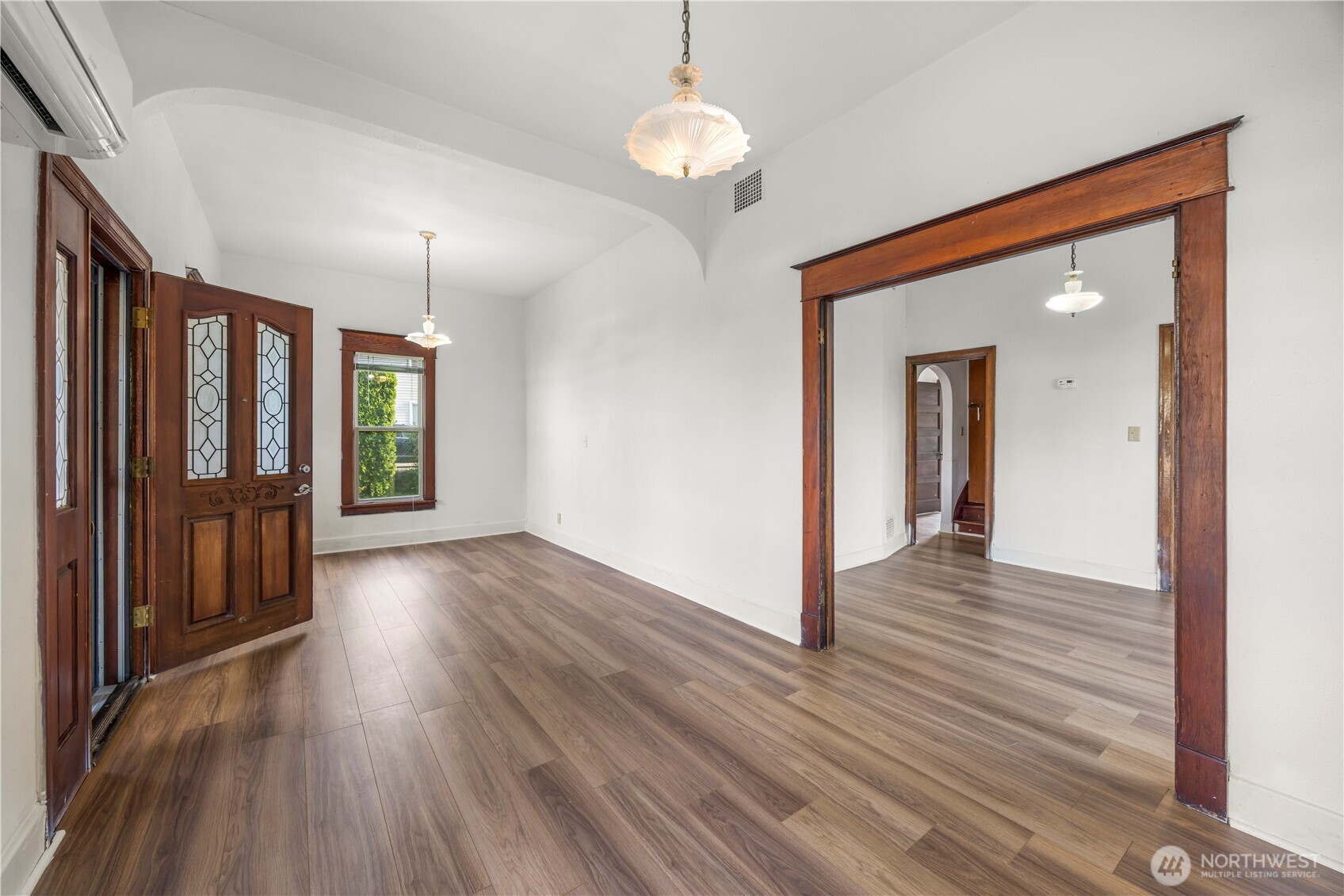 1624 Wright Avenue Sumner, WA 98390 - Photo 14 of 29 a view of a hallway with wooden floor and chandelier
