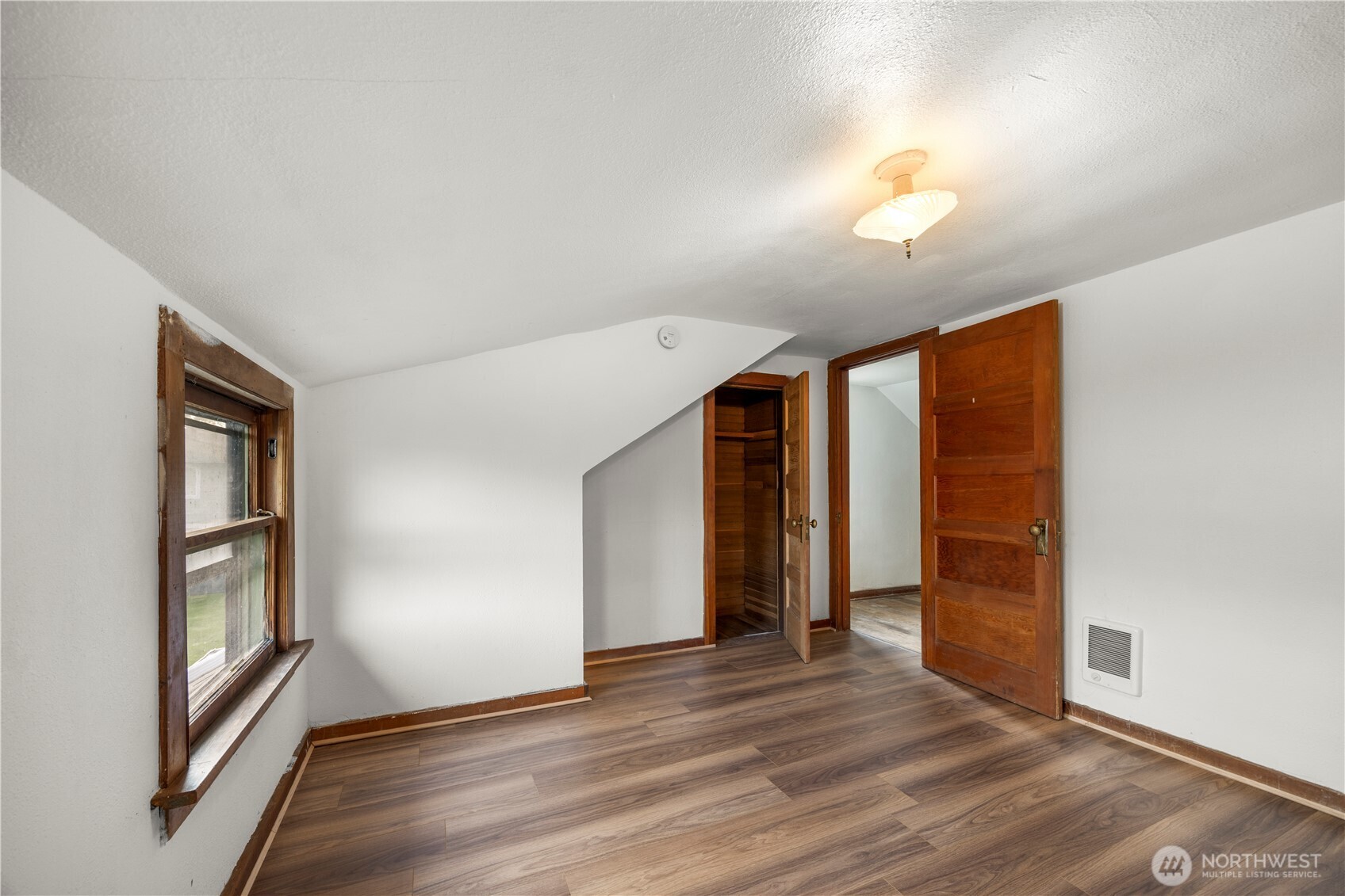 1624 Wright Avenue Sumner, WA 98390 - Photo 15 of 29 an empty room with wooden floor and windows