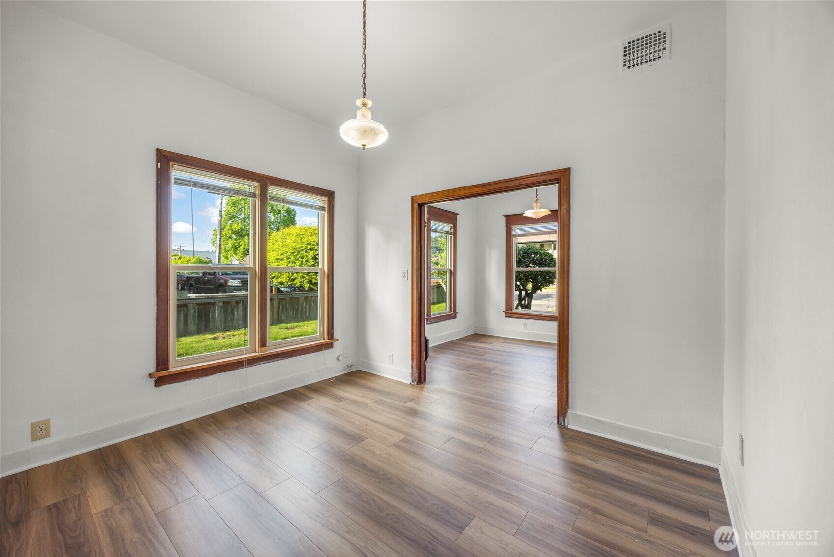1624 Wright Avenue Sumner, WA 98390 - Photo 17 of 29 a view of an empty room with wooden floor and a window